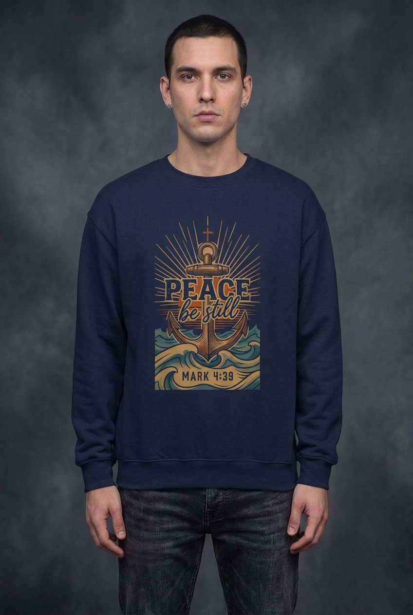 Male model wearing the navy-blue Peace Be Still sweatshirt
