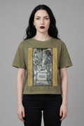 Same gothic female model wearing the olive Women at the Well tee